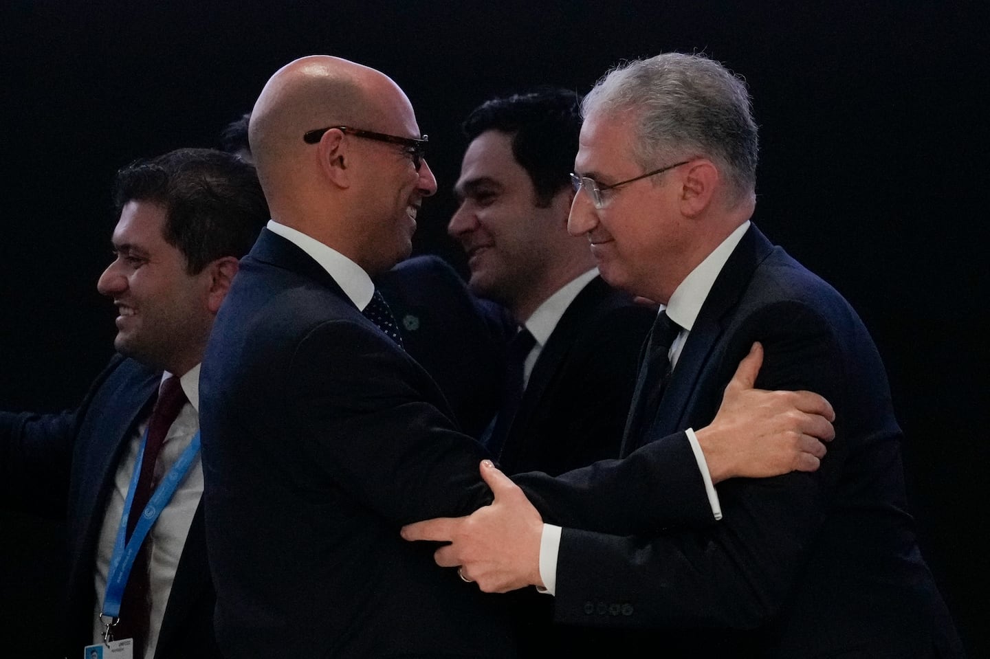 Mukhtar Babayev, COP29 president, (right) embraced Simon Stiell, United Nations climate chief, after reaching a deal for money to curb climate change at the COP29 UN Climate Summit.