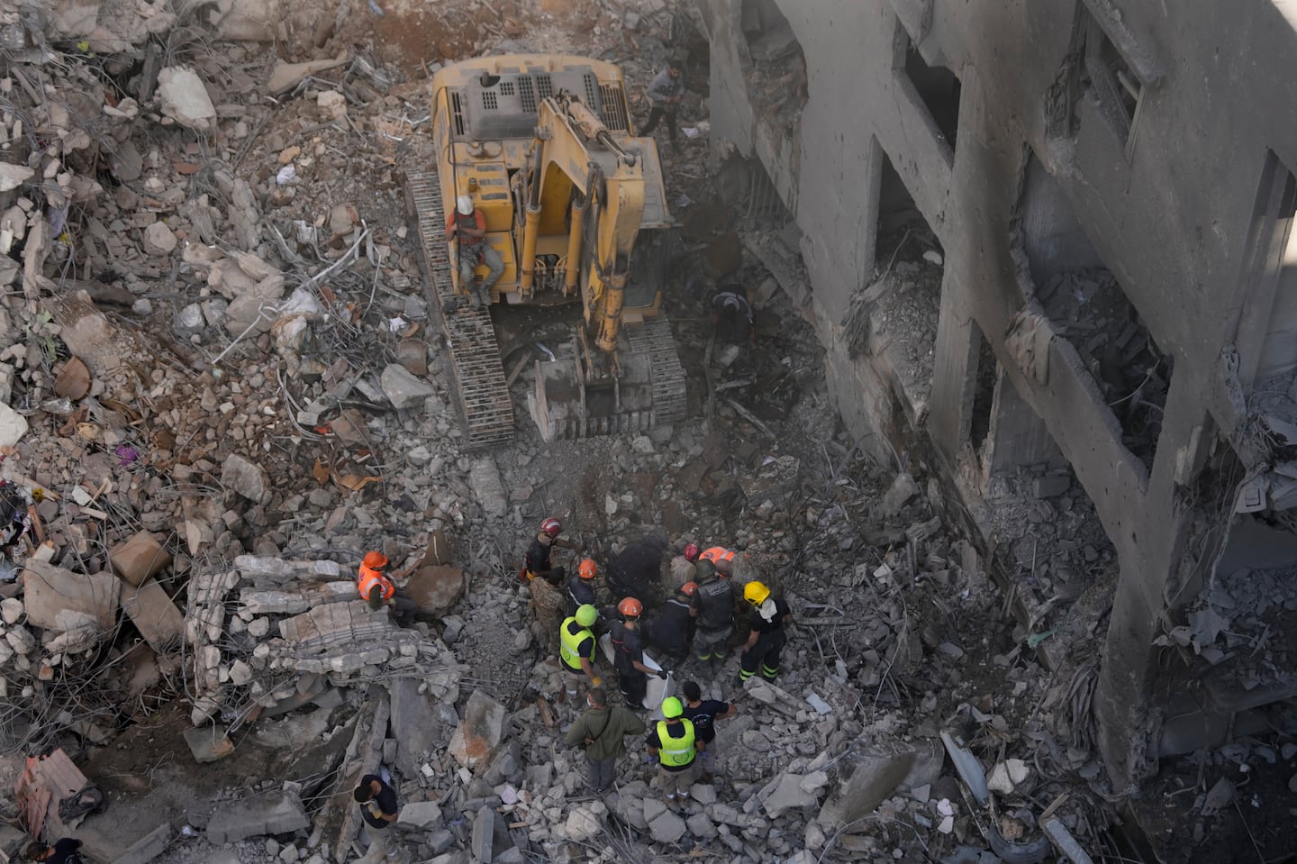 Rescue workers search for victims at the site of an Israeli airstrike that hit central Beirut, Lebanon, on Nov. 23.