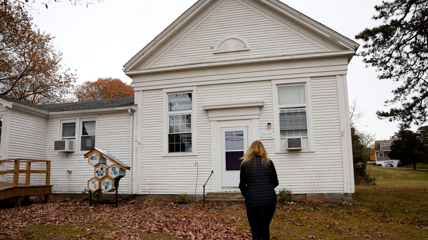 Herring Pond Wampanoag chair Melissa Ferretti made her way to the tribe's meeting house in Plymouth. Governor Maura Healey recently granted the tribe state recognition, the first in 48 years.