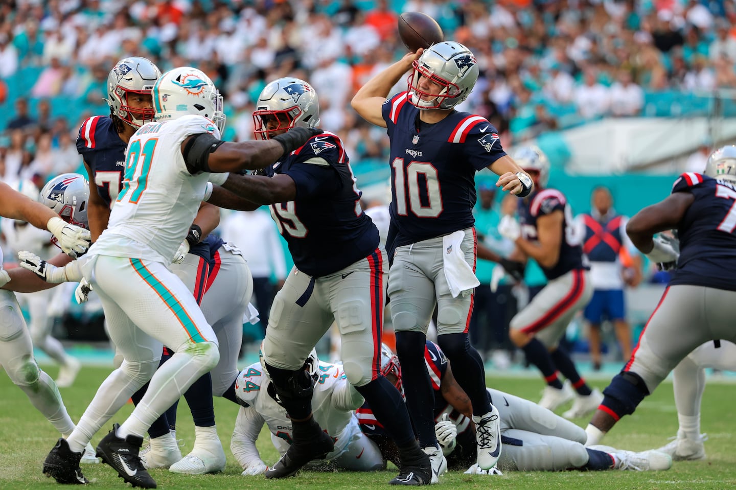 The Patriots can build around Drake Maye (center) but first they need a line to block for him.