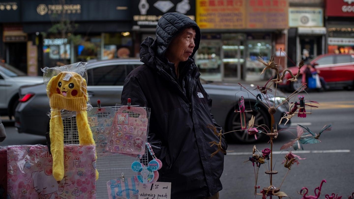 Shaohua Yu, who has occupied a spot between Mulberry and Mott streets almost every day for more than 20 years, at his stand in Manhattan’s Chinatown earlier this month, said that hustle could no longer promise prosperity to immigrants working in the neighborhood.