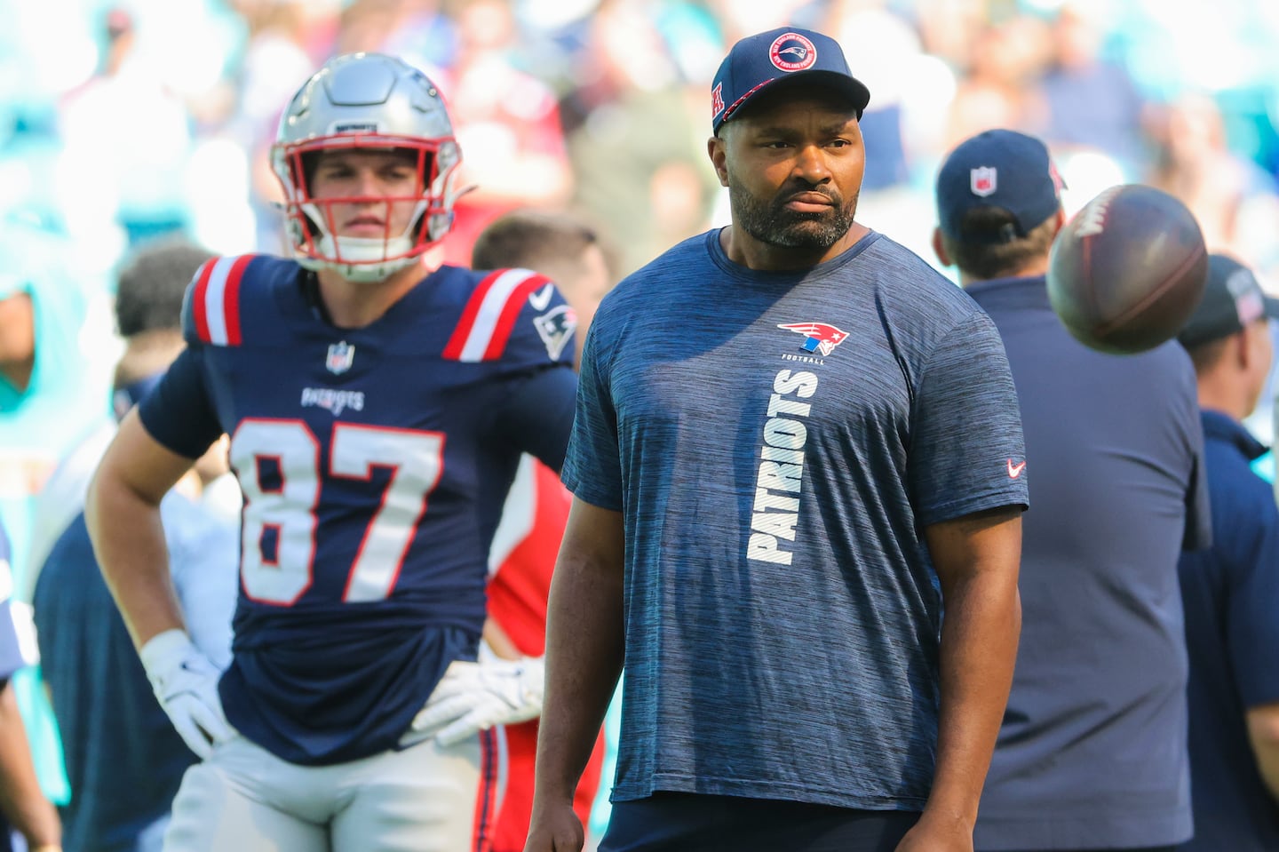 Jerod Mayo looks on as his team warms up before facing the Dolphins at Hard Rock Stadium.