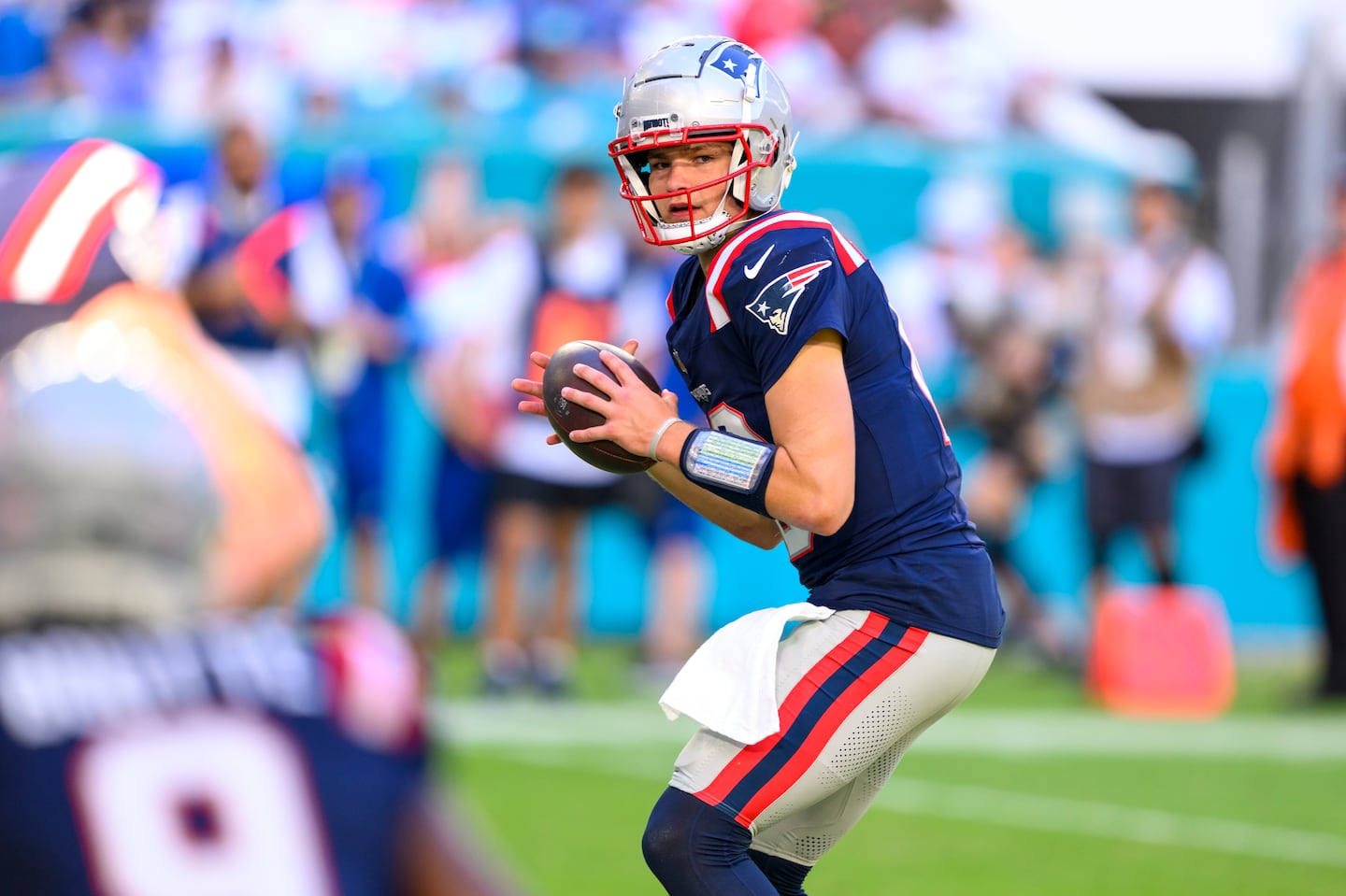 Patriots quarterback Drake Maye looks to throw against the Dolphins.