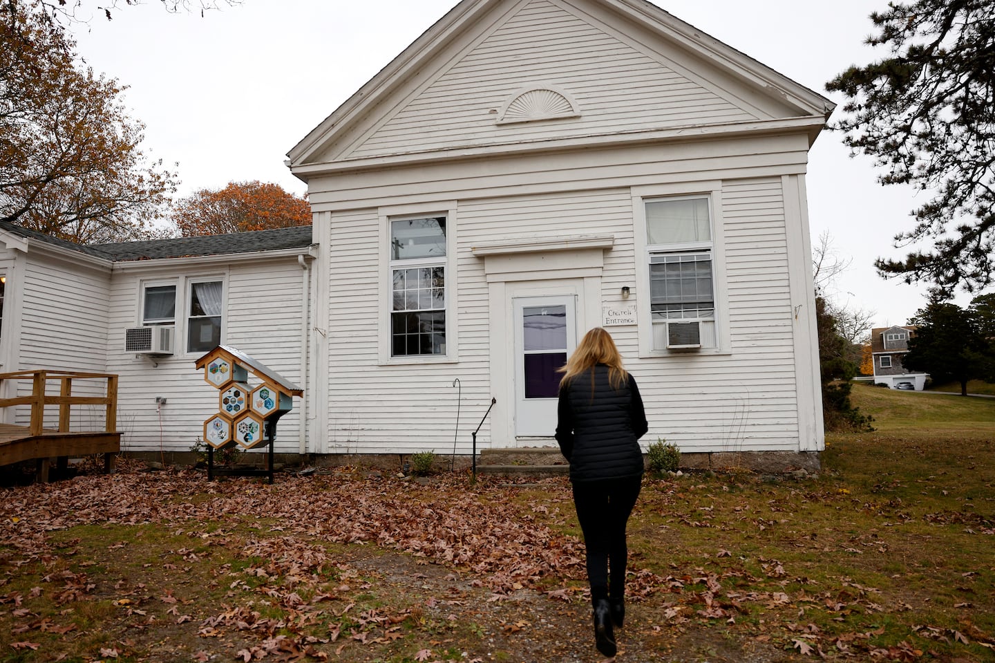 Herring Pond Wampanoag chair Melissa Ferretti made her way to the tribe's meeting house in Plymouth. Governor Maura Healey recently granted the tribe state recognition, the first in 48 years.