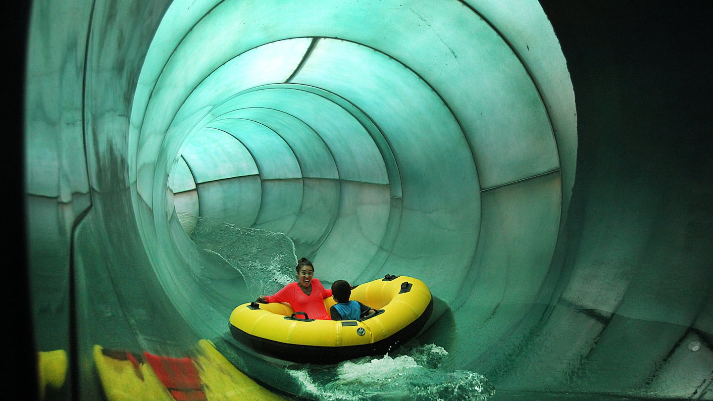 Tarsha Ancrum and her son Denzel, 6, of Lynn, headed down one of the giant water slides at Great Wolf Lodge in Fitchburg in 2014.