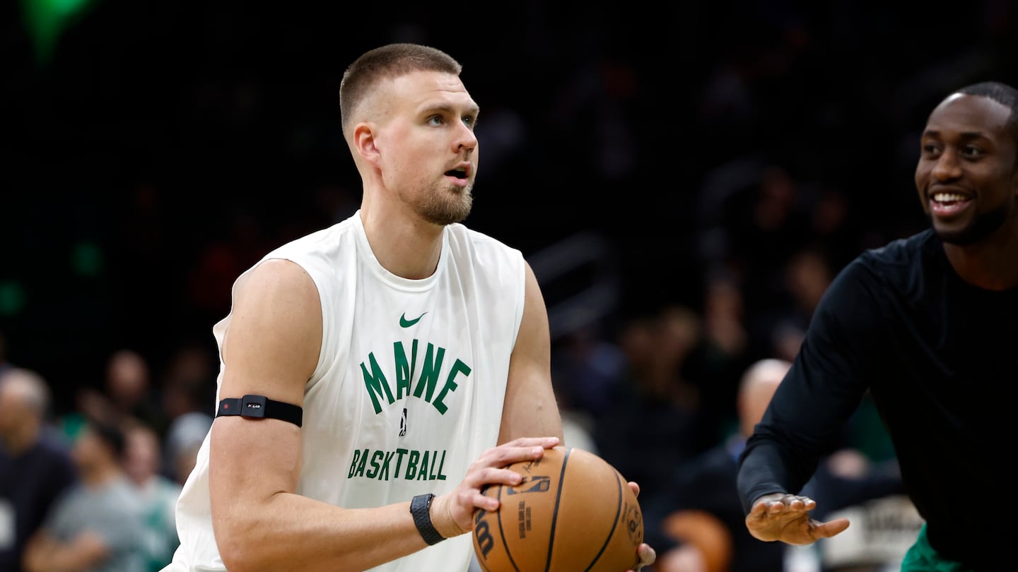 Celtics center Kristaps Porzingis warms up before making his season debut after having ankle surgery during the offseason.