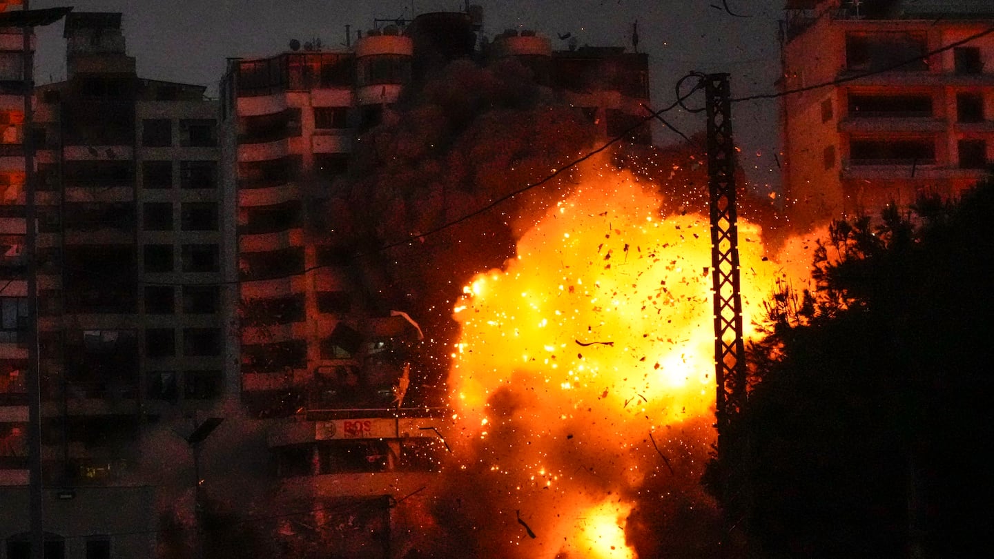 Thick smoke, flames, and debris erupt from an Israeli airstrike that targeted a building in Tayouneh, Beirut, Lebanon, on Nov. 25.