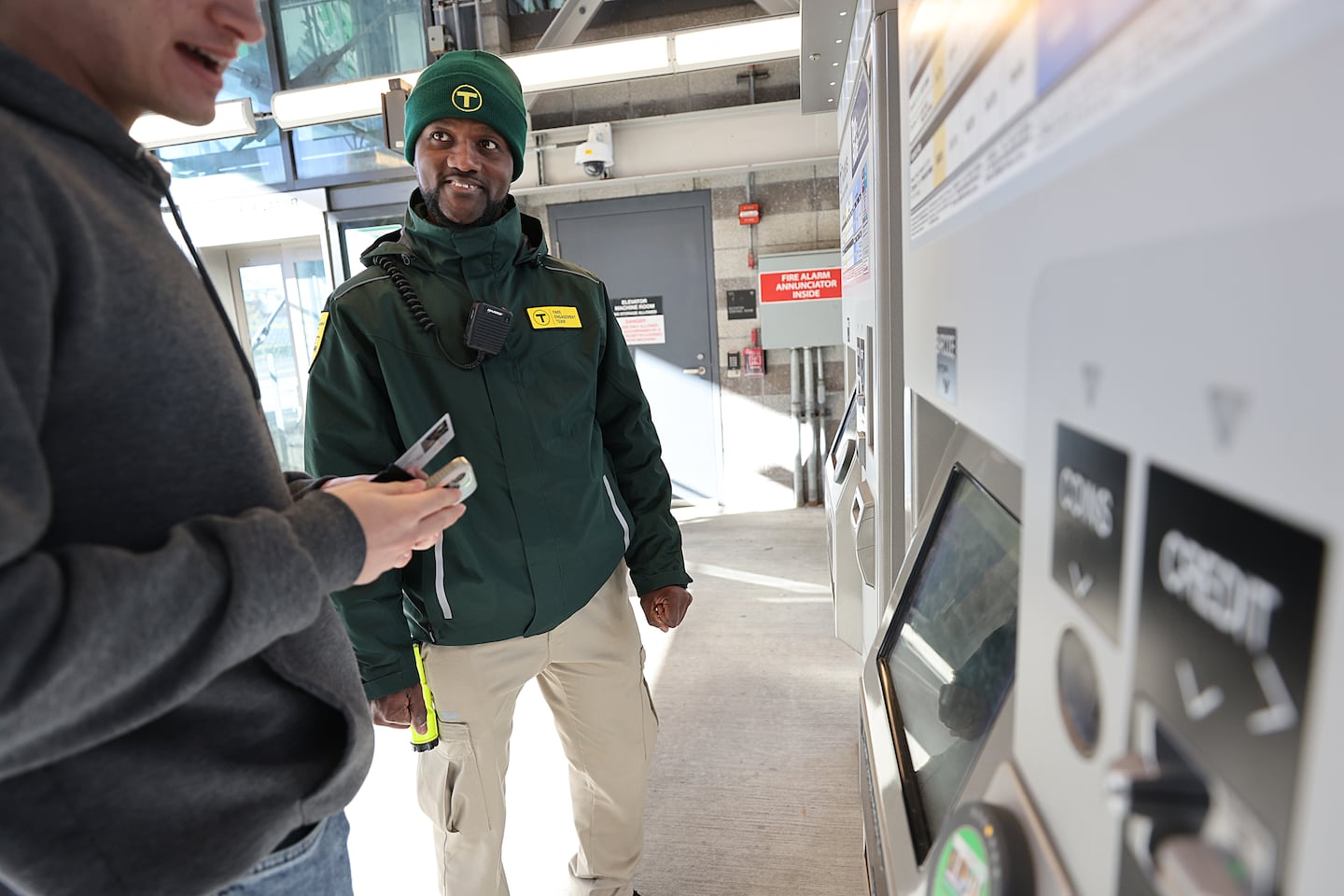 At Lechmere Station, fare engagement representative Frantzlay Mentor assisted a rider.