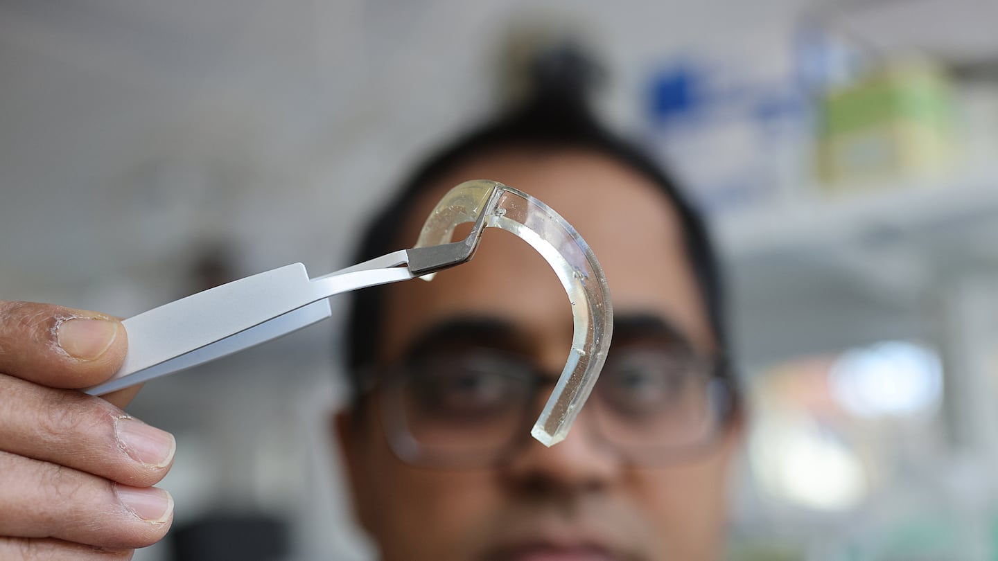 At Tufts University, Professor Sameer Sonkusale holds a piece of the gel that is being used to design tiny patches that will detect cognitive decline and risk of falling in older adults.