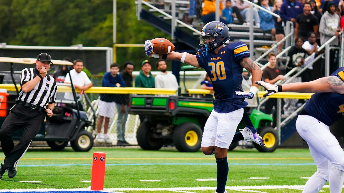 UMass Dartmouth cornerback Shane Meerbott returns an interception for a touchdown against Nichols College.