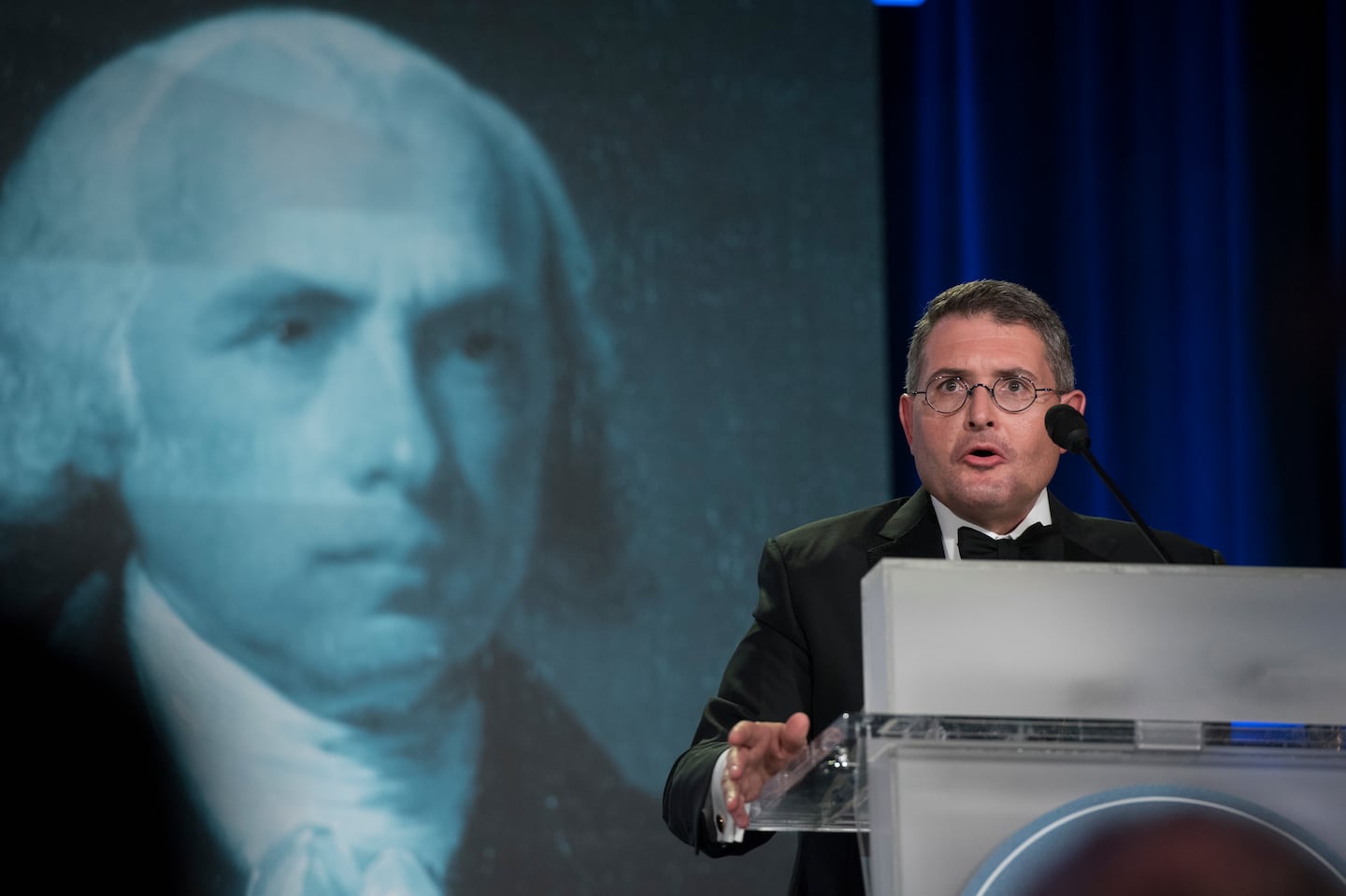 An image of former president James Madison is seen behind Leonard Leo, as he speaks at the National Lawyers Convention in Washington, on Nov. 16, 2017.