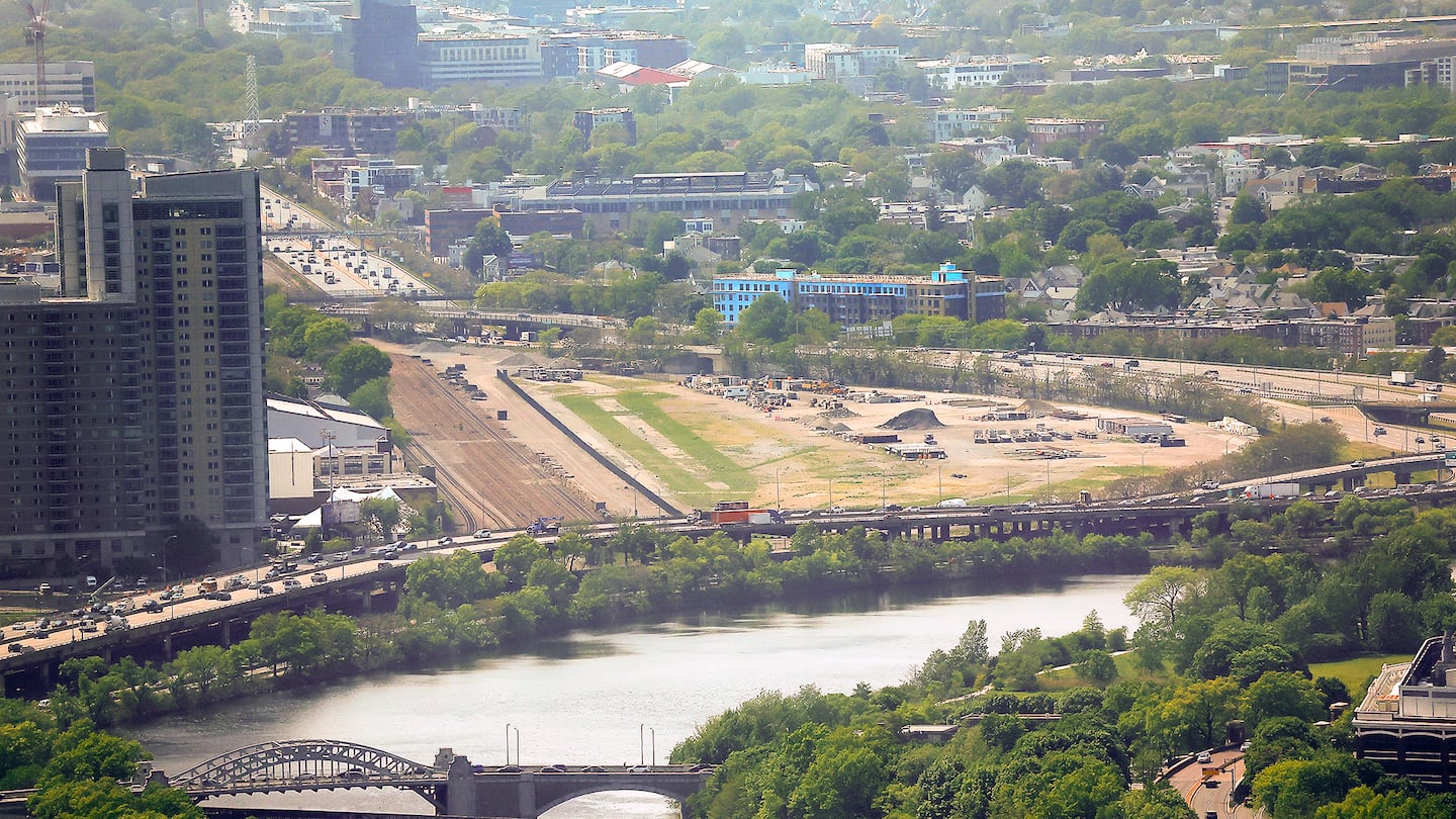 The Boston University Bridge over the Charles River, the elevated section of the Massachusetts Turnpike, and the Beacon Park Yard in Allston, as seen from View Boston, the viewing platform on the upper floors of the Prudential tower.