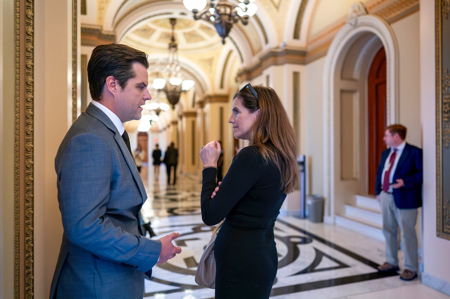 Representatives Matt Gaetz, left, and Nancy Mace, right, confer  at the US Capitol on Sept. 29.