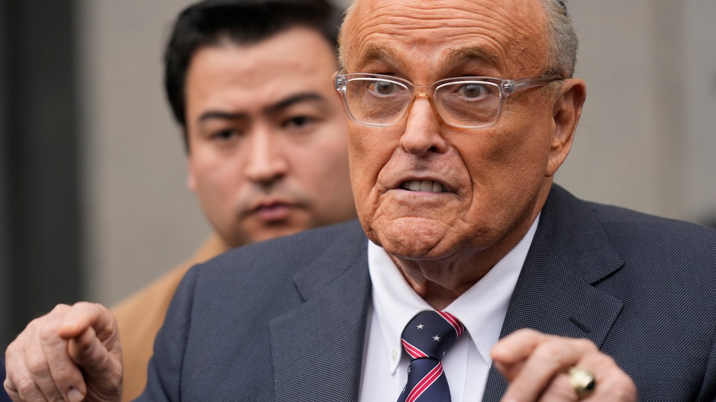 Rudy Giuliani speaks to reporters as he leaves the federal courthouse in New York, Tuesday, Nov. 26, 2024.