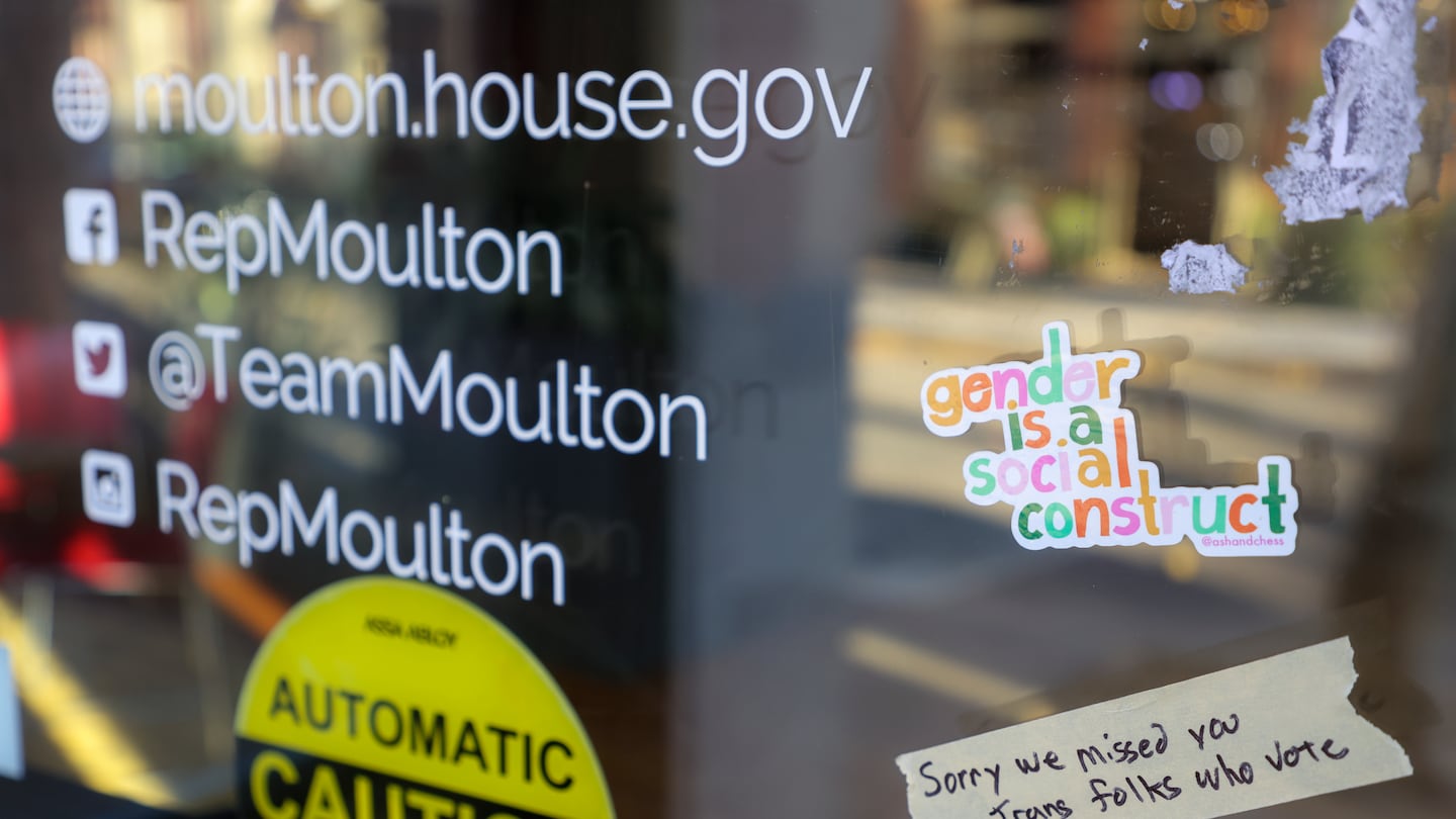 Protesters placed a sticker on the front door of congressman Seth Moulton’s office after he made comments about transgender athletes after the election.