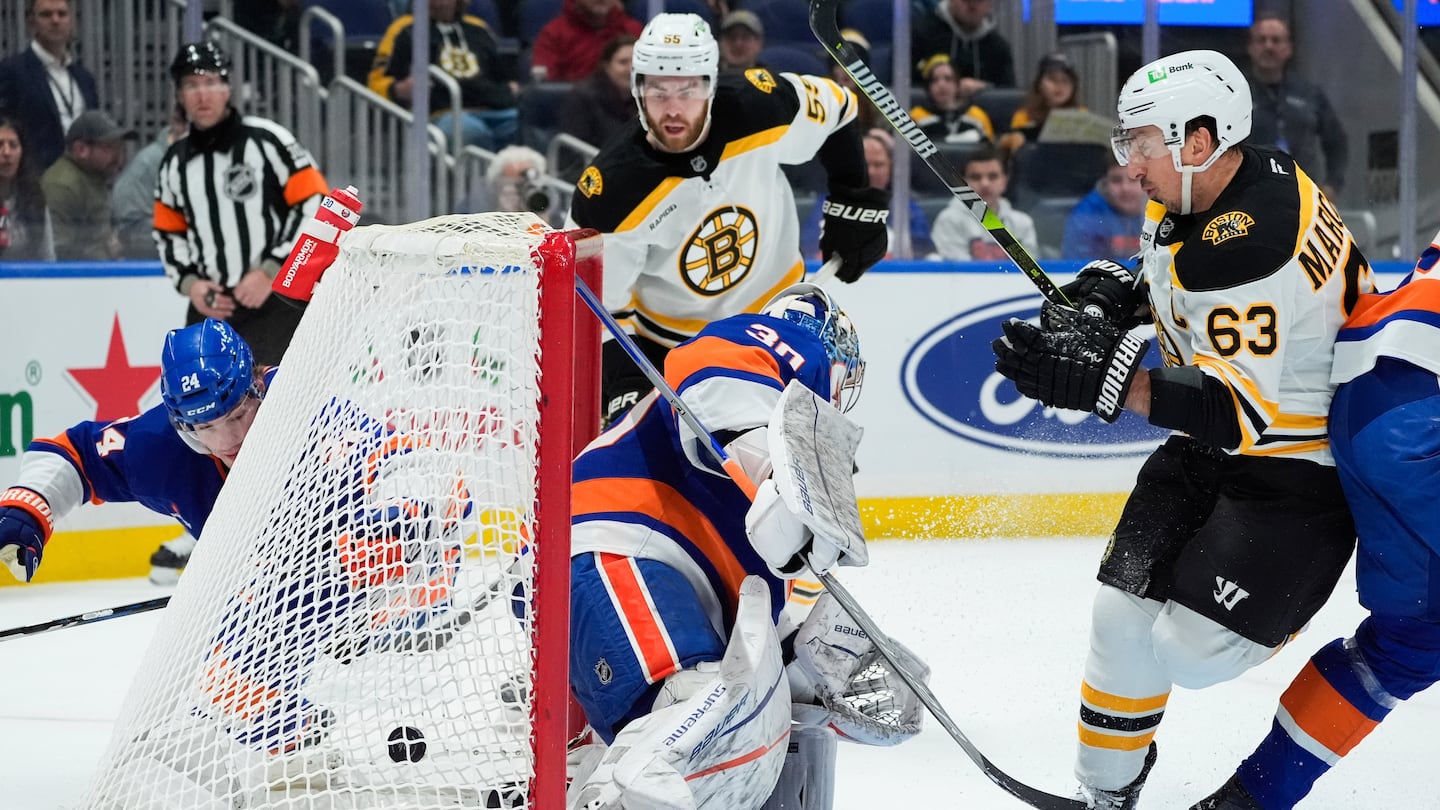 Bruins left wing Brad Marchand (right) scored his second goal of the first period against the Islanders.