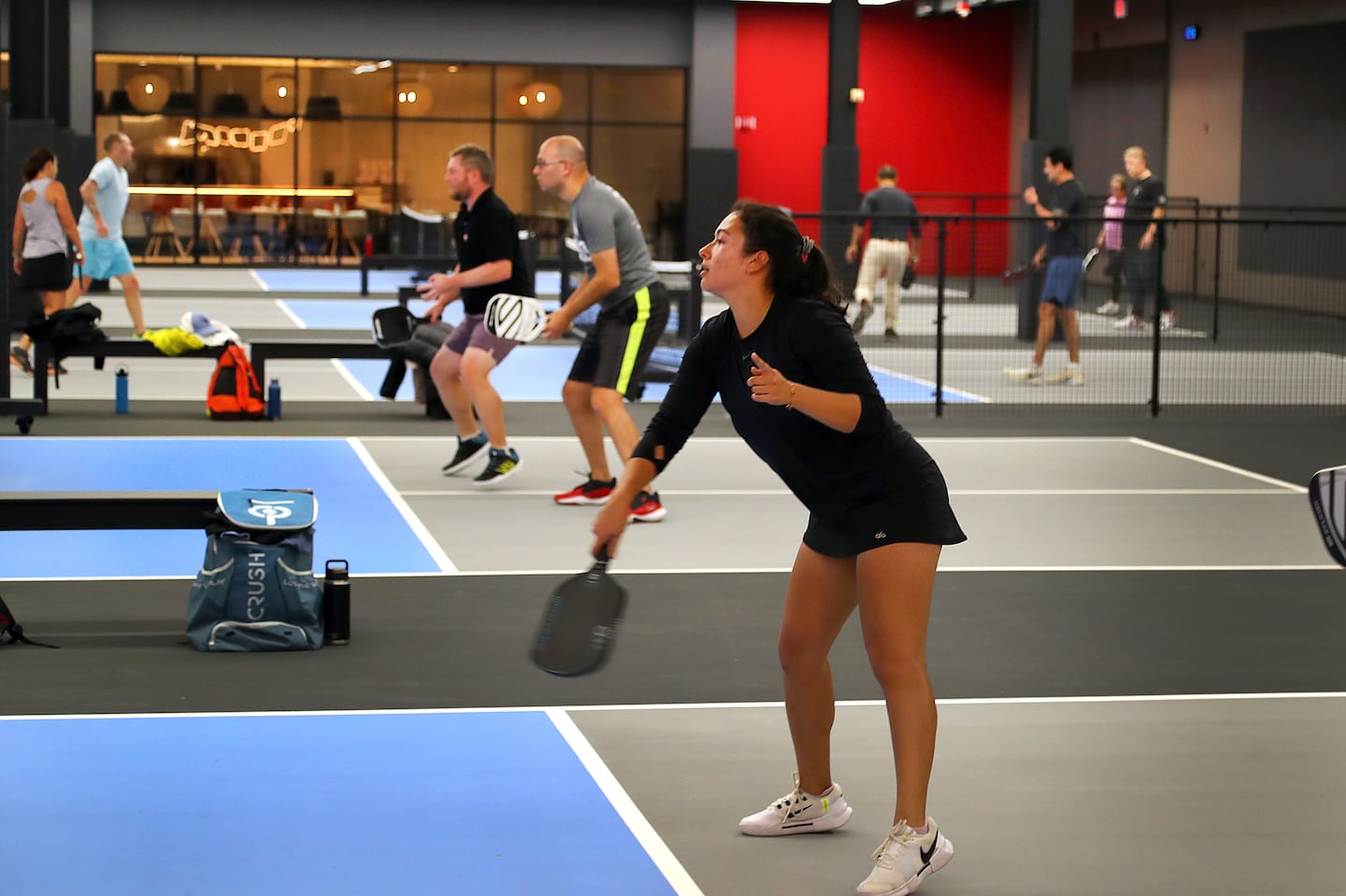 People played pickleball Tuesday at the newly opened Bosse, a pickleball supercenter housed in the space of the former Nieman Marcus store at the Natick Mall.