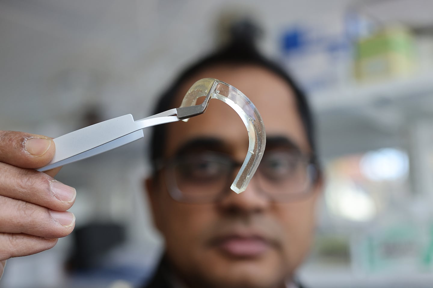 At Tufts University, professor Sameer Sonkusale held a piece of the gel that is being used to design tiny patches that will detect cognitive decline and risk of falling in older adults.