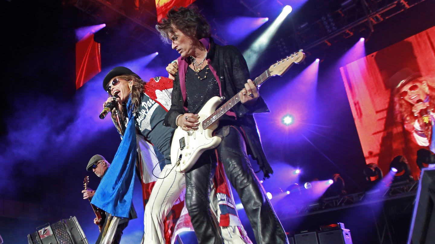 Brad Whitford, Steven Tyler, and Joe Perry of Aerosmith performing at Fenway Park in Boston on Aug. 15, 2010.