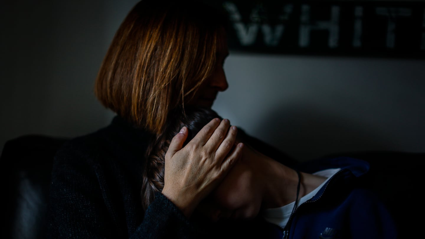 Emily posed for a portrait with her 12-year-old transgender son. 