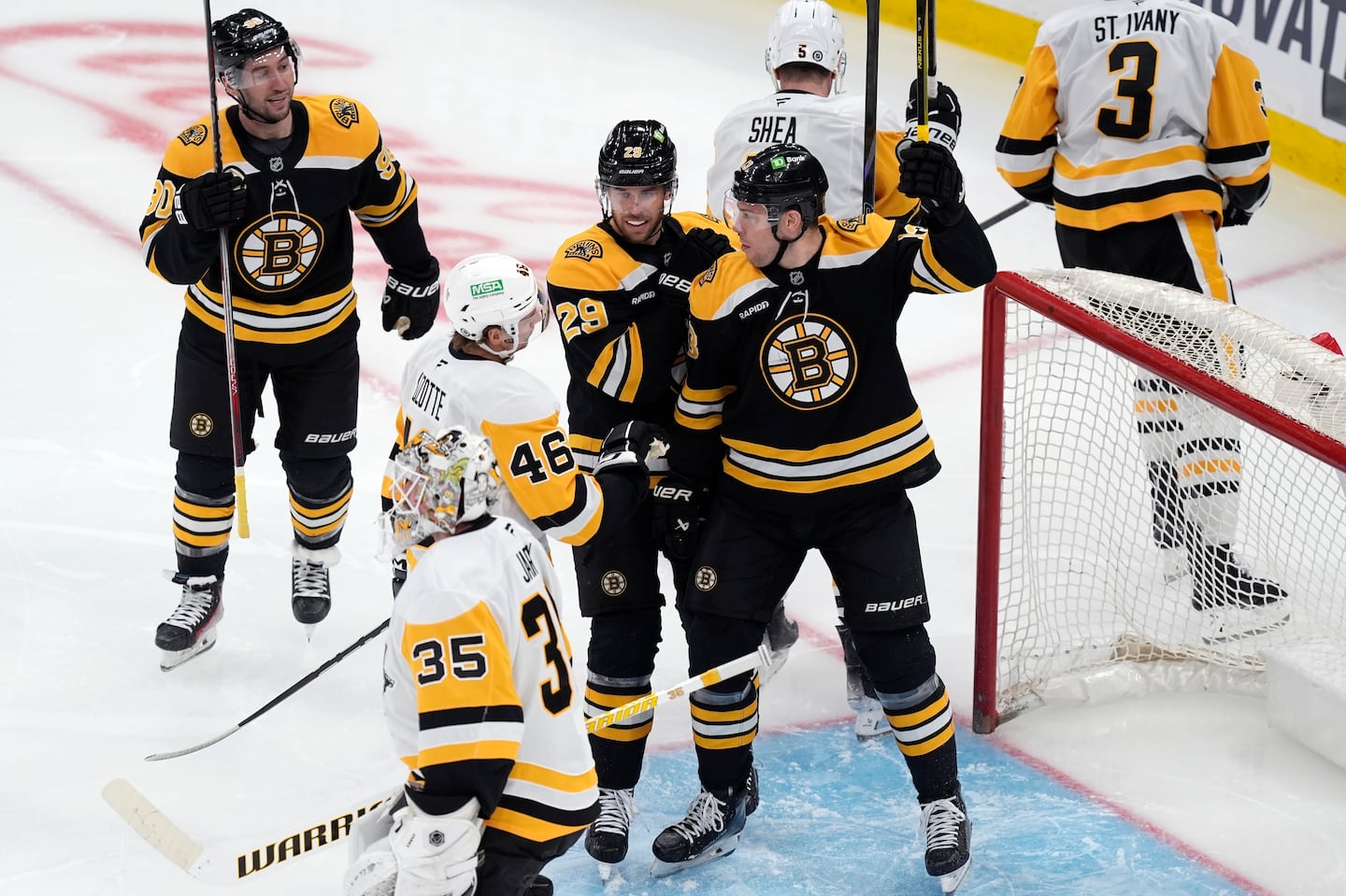 Bruins forward Charlie Coyle (13) celebrates his first-period goal against the Penguins and goaltender Tristan Jarry (35) for a 1-0 lead in Friday night's game at TD Garden.