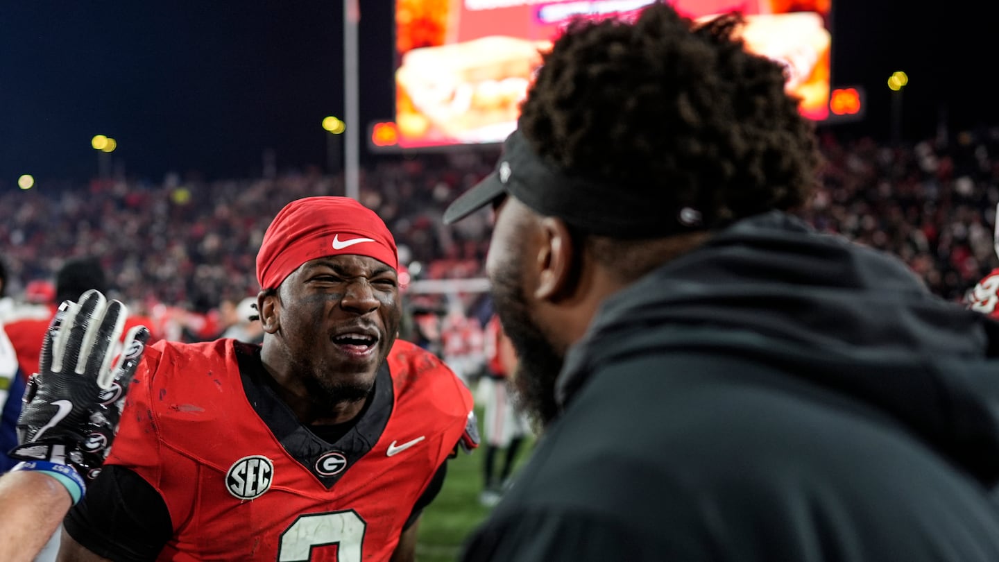 Georgia running back Nate Frazier celebrates after his game-winning two-point rush gave the Bulldogs the victory in eight overtimes over Georgia Tech Friday night in Athens, Ga. 