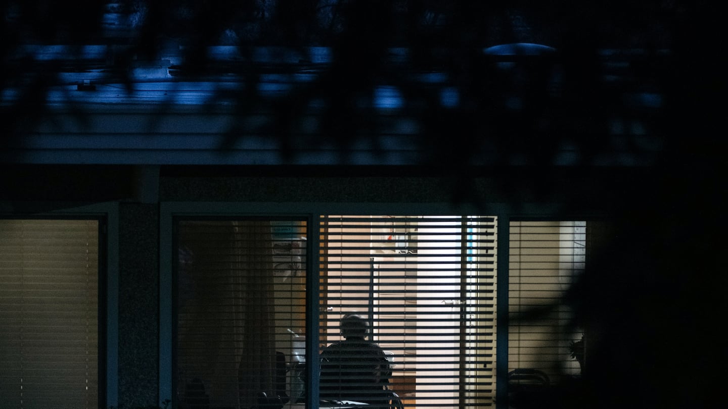 A resident was seen through a window at the Life Care Center of Kirkland, Wash. in 2020.