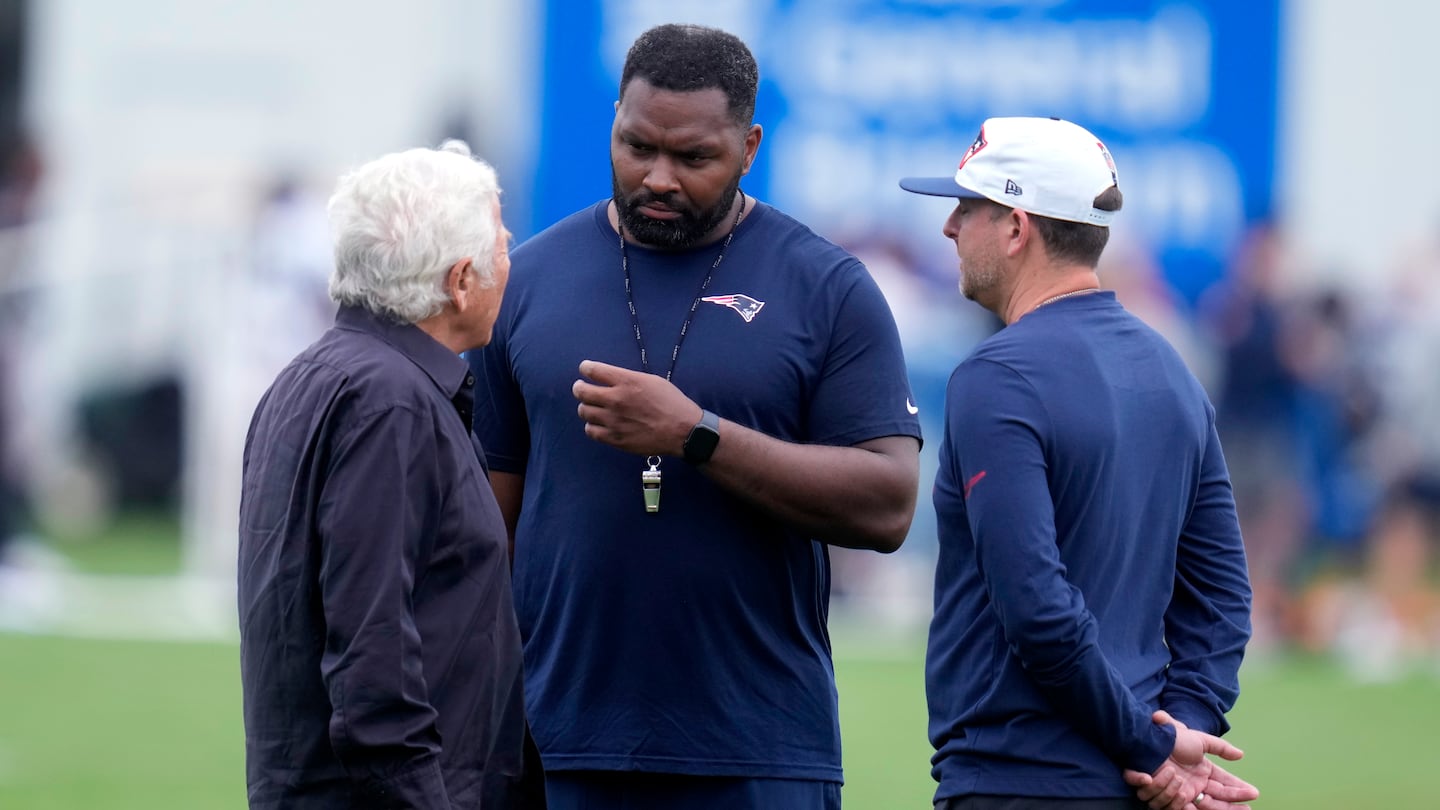 Patriots coach Jerod Mayo (center) and vice president of player personnel Eliot Wolf have had a rough first season for Patriots owner Robert Kraft.