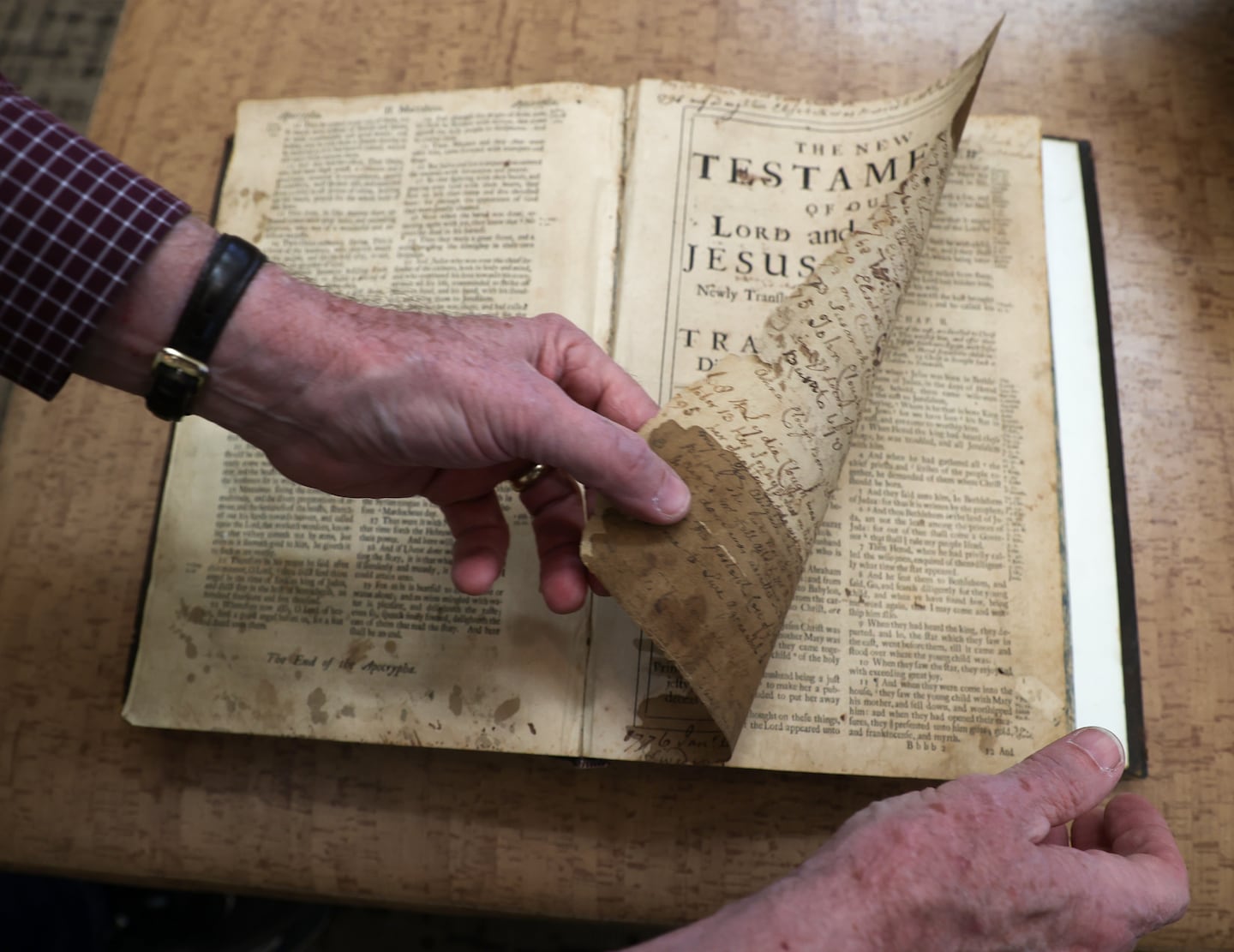 Amateur genealogist Harry Bulkeley displayed a family Bible from 1715 that his family is donating to the Old North Church. The Bible documents the descendants of Ebenezer Clough, the master bricklayer who built the church and built himself a home on the land behind it that is now part of the Old North historic site.