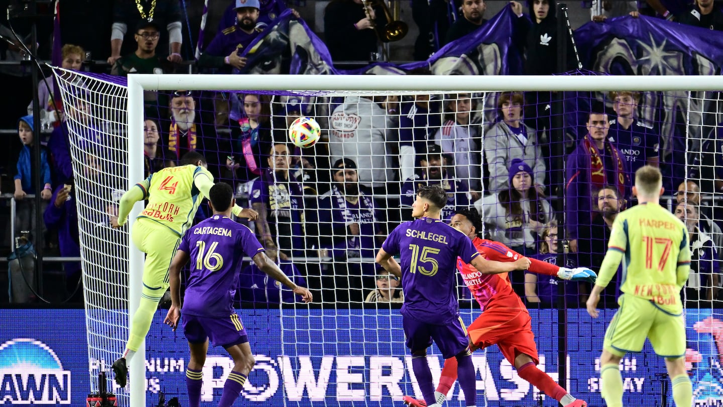 Andrés Reyes heads home the only goal of Saturday night in Orlando, early in the second half of the Eastern Conference final.