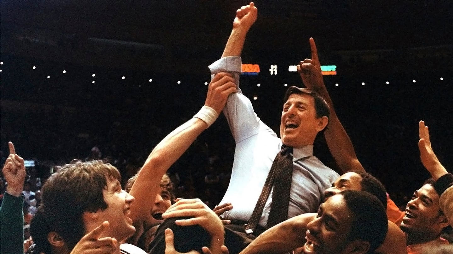 St. John's coach Lou Carnesecca is carried by his team after the Redmen beat Boston College in the Big East championship at Madison Square Garden, on March 12, 1983.