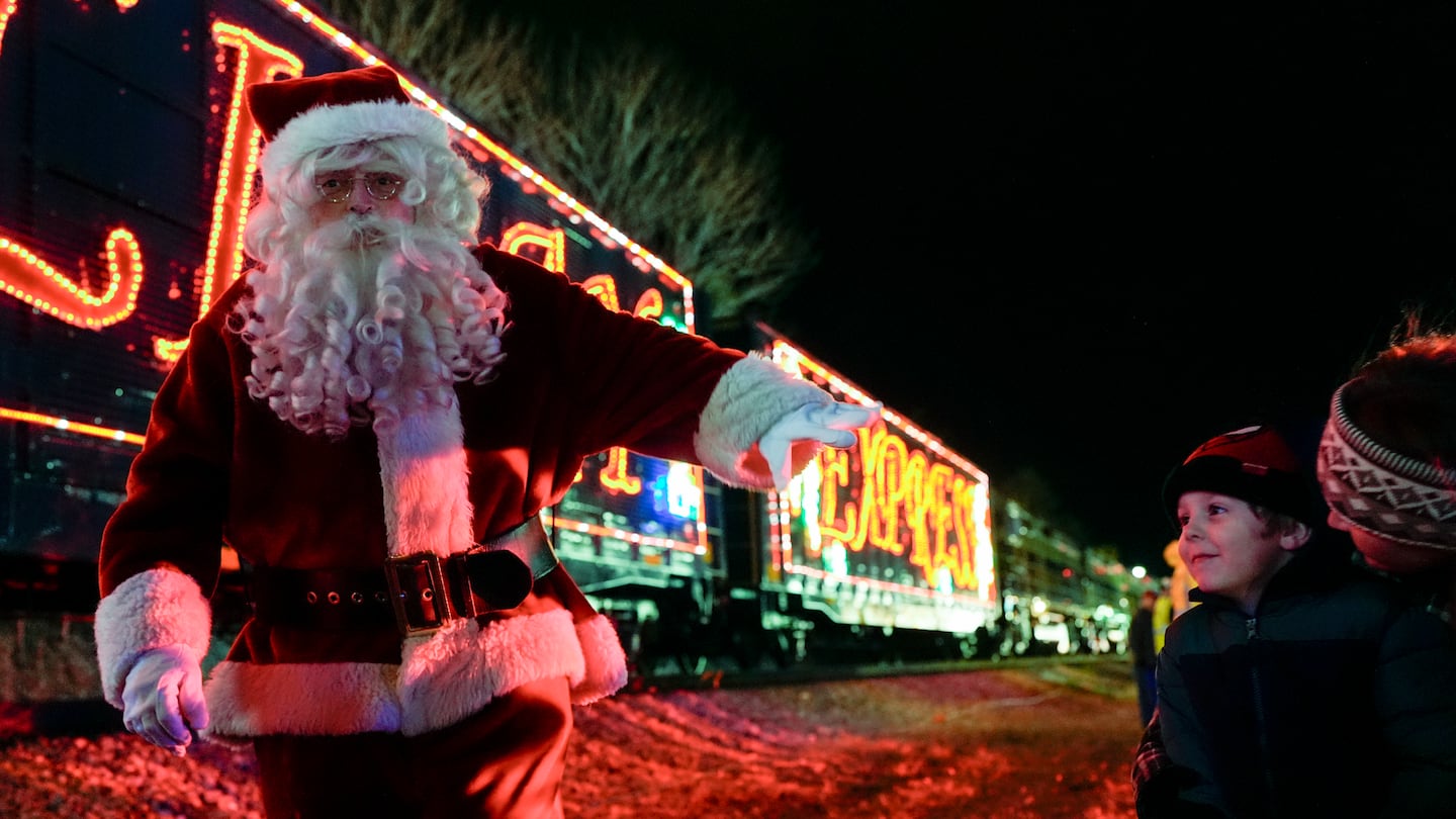 Santa Claus waved to children during a visit of the CSX Holiday Express last Thursday in Erwin, Tenn. The railway company held a celebration and concert for the town affected by Hurricane Helene.