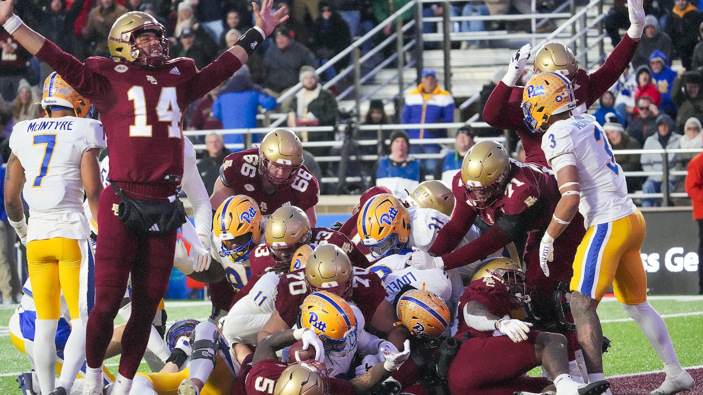 BC quarterback Grayson James (No. 14) celebrates after running back Kye Robichaux (No. 5) plows into the end zone for a second-quarter touchdown in the Eagles' 34-23 triumph over Pittsburgh at Alumni Stadium.