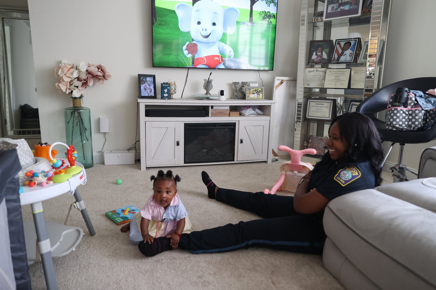 Kamisha Green, a Boston police officer, with her daughter, Zoey Grace, at their home. Green says without the city's paid family leave policy, she would've had to choose between starting a family when she wanted to, and her dream job.