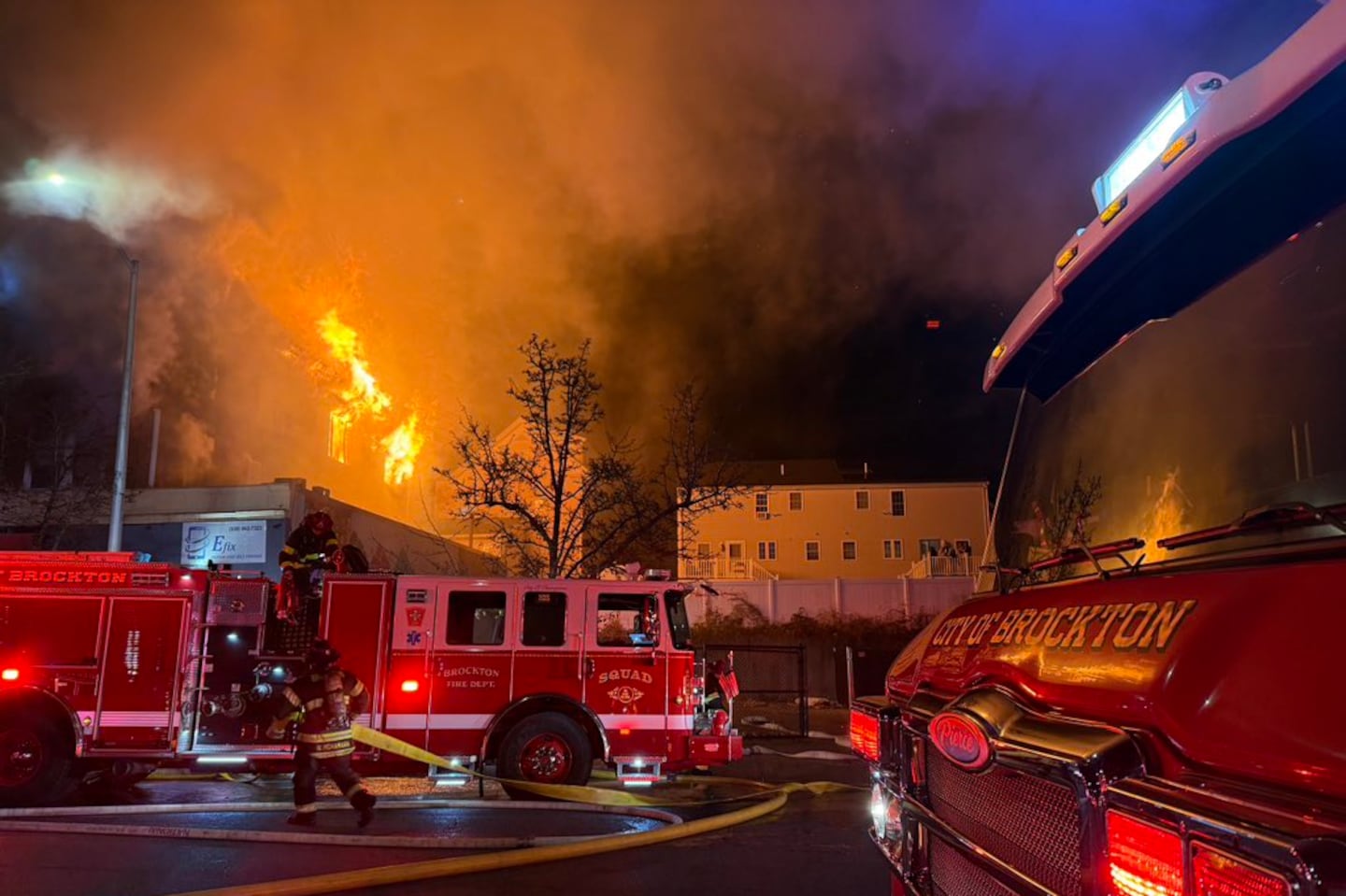 A three-alarm blaze tore through an unoccupied four-story building in Brockton on Saturday evening, destroying three homes, fire officials said.