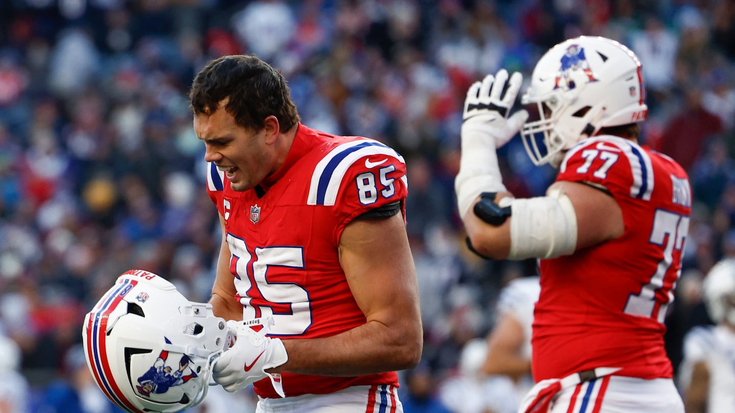 Patriots tight end Hunter Henry reacted with anger after the Colts came up with an interception on a tipped ball.