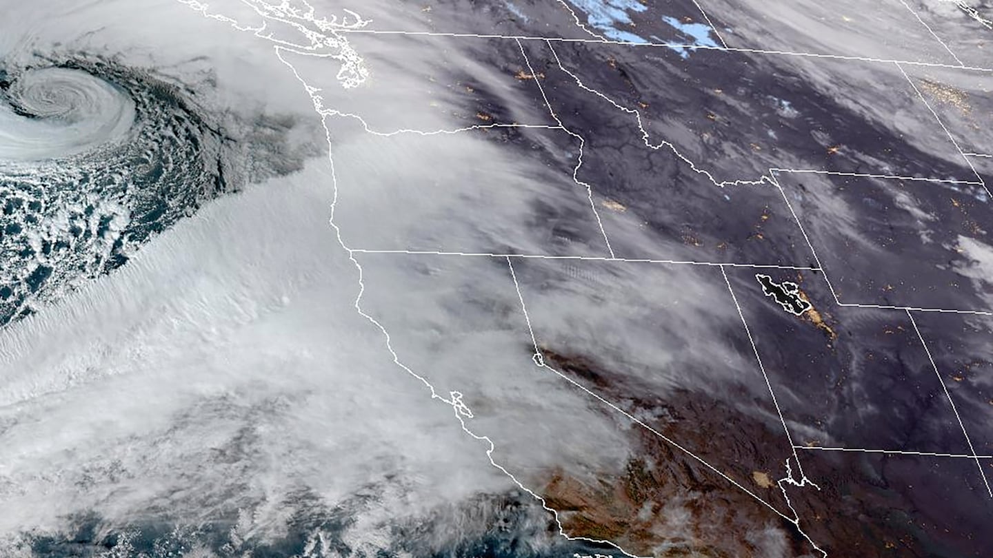 This Tuesday satellite image provided by NOAA shows an atmospheric river moving in on Northern California and the Pacific Northwest.