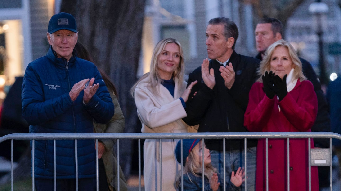 President Biden accompanied by his family from left, Melissa, Hunter Biden, grandson Beau, and First Lady Jill Biden, applauds during a Christmas tree lighting ceremony in downtown Nantucket Mass., on Nov. 29.