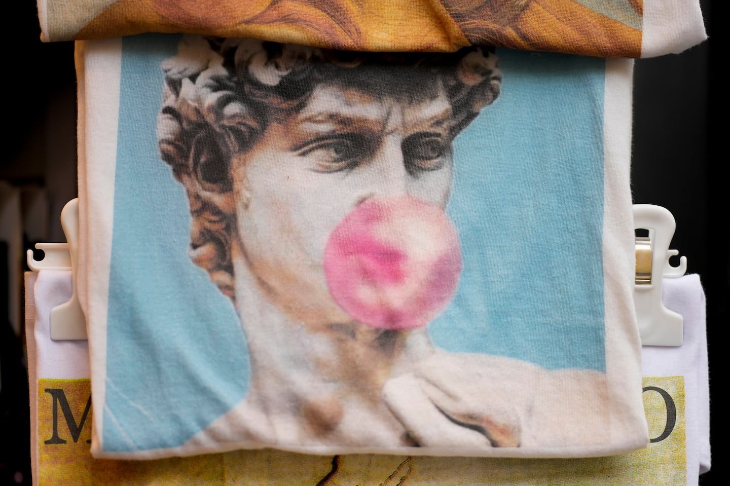 A souvenir bag for sale in Florence, Italy. Michelangelo’s "David" has been a towering figure in Italian culture for centuries, but curators worry the marble statue’s religious and political significance is being diminished by the proliferation of its image.