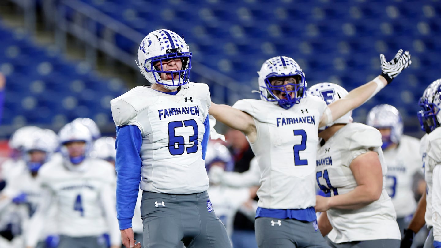 Fairhaven’s Fin Reynolds (63) and Colby Correia (2) celebrated their win over Salem, 26-22, in the Division 6 Super Bowl last December at Gillette Stadium.