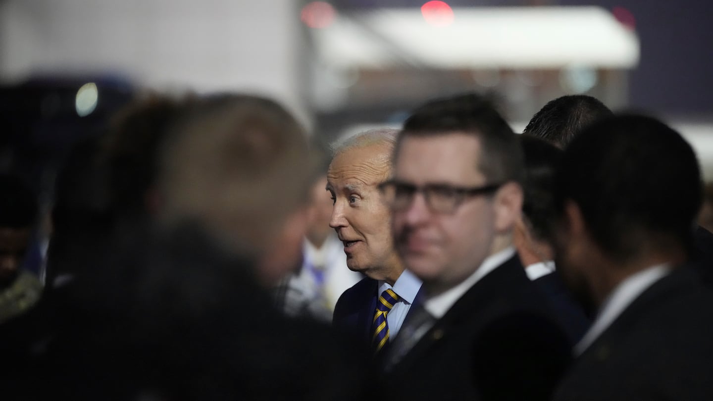 President Biden greets well wishers after arriving at Quatro de Fevereiro international airport in the capital Luanda, Angola on Dec. 2, on his long-promised visit to Africa.