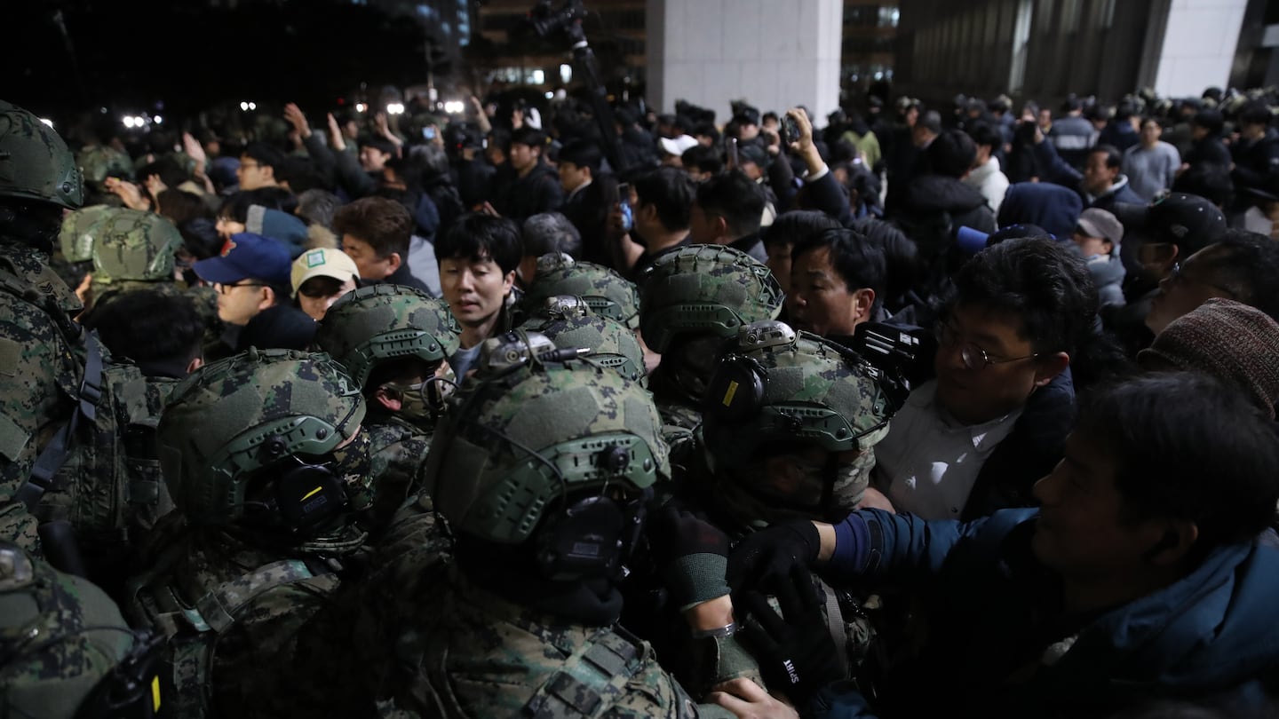 South Korean soldiers tried get into the national assembly on Wednesday in Seoul, South Korea. Yoon Suk Yeol announced he was taking the step, which enacts temporary rule by the military, during a televised speech on Tuesday, saying it was critical for defending the country's constitutional order.