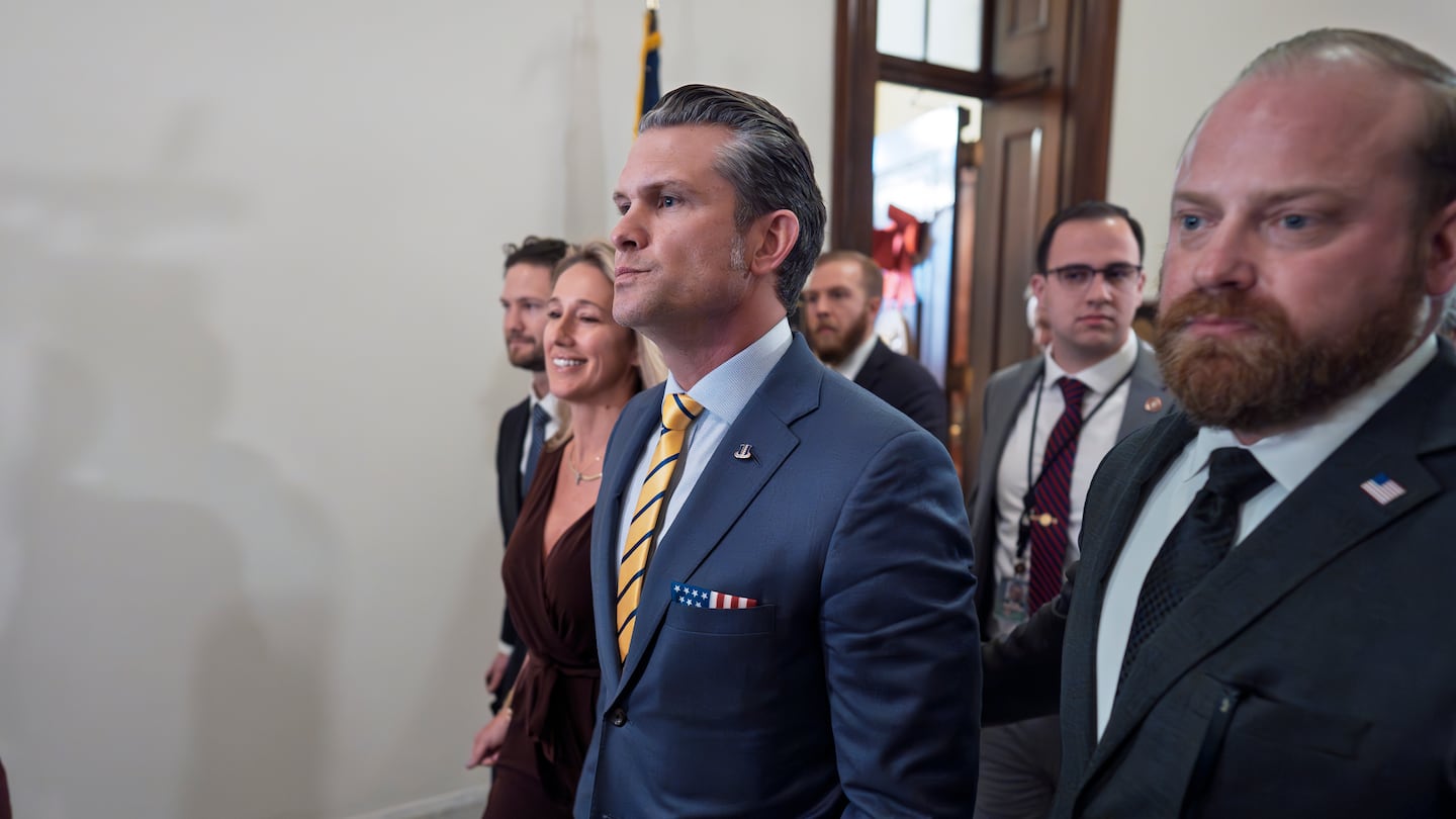 Pete Hegseth, President-elect Donald Trump's nominee to be defense secretary, is joined by his wife Jennifer Rauchet, left, as they arrive to meet with Senator Ted Budd, a member of the Senate Armed Services Committee, at the Capitol in Washington, on Dec. 3.