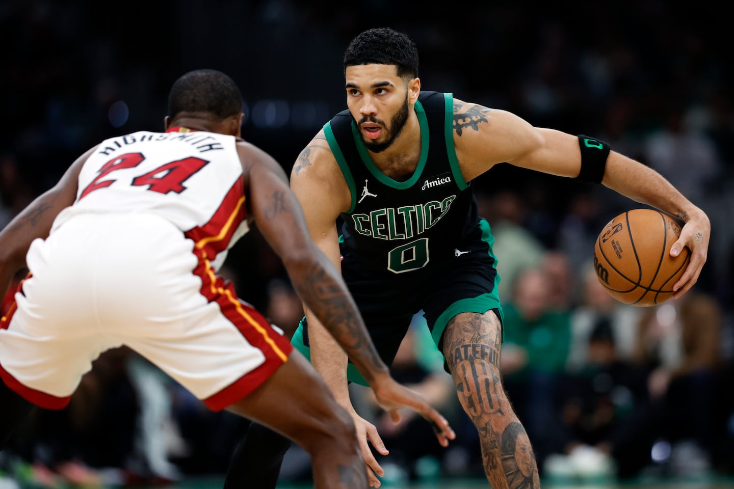 Celtics forward Jayson Tatum (0) goes up against Miami Heat forward Haywood Highsmith (24) during the second quarter at TD Garden. (Danielle Parhizkaran/Globe Staff)