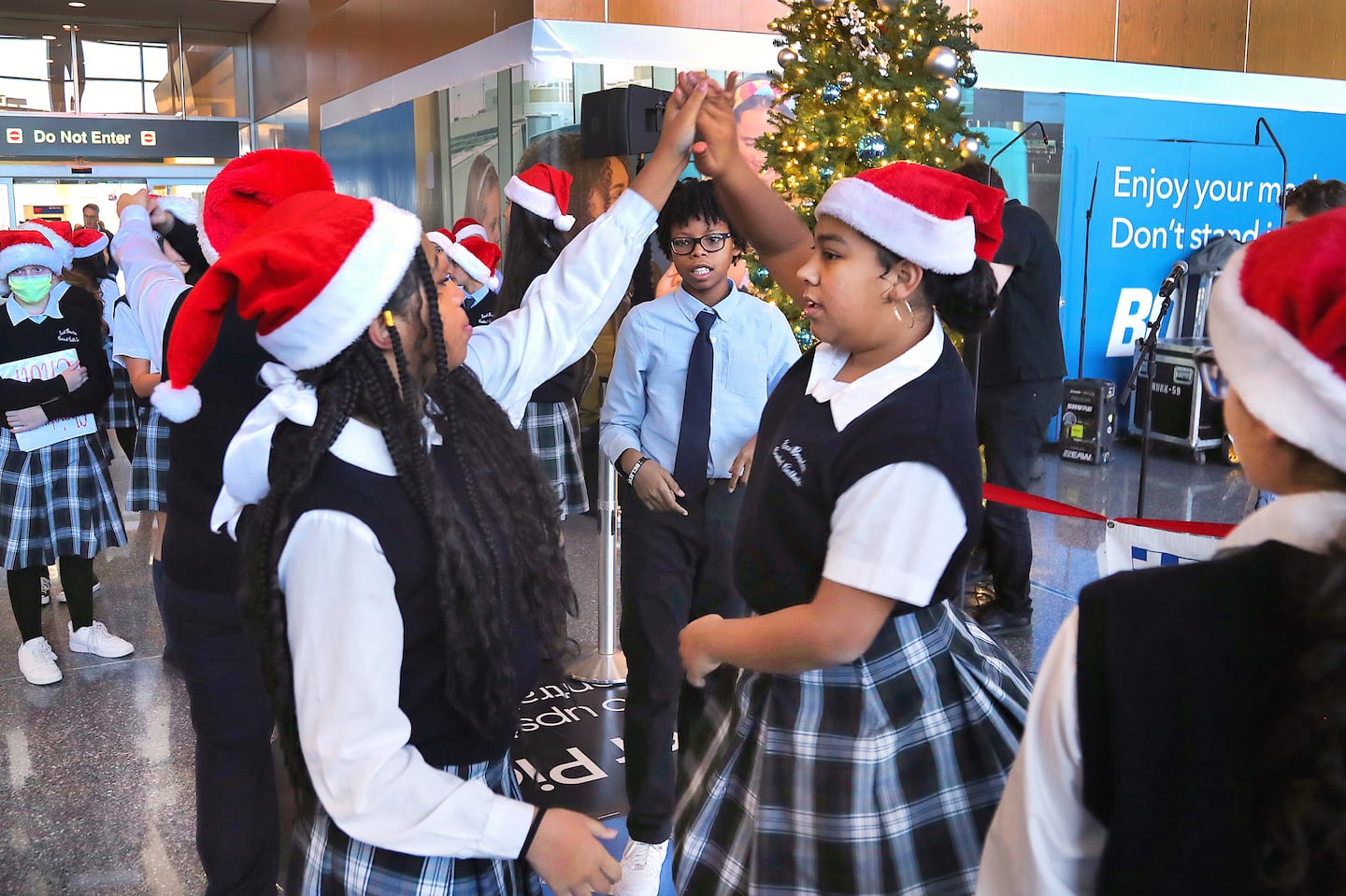 Eighth-grade students at the East Boston Central Catholic School Choir rehearsed a dance in Terminal A at Logan Airport on Dec. 21, 2023.