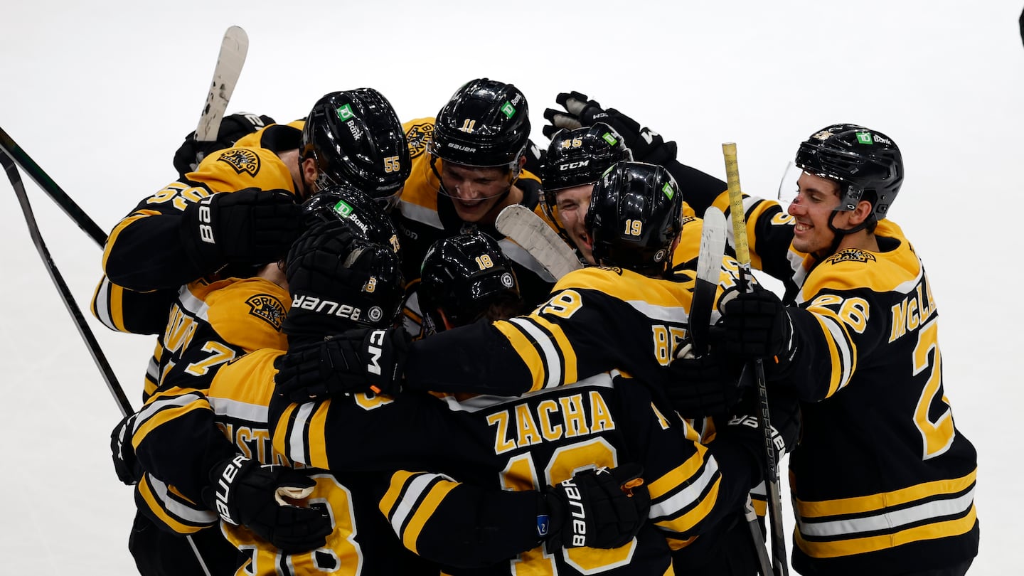 The Bruins mobbed Pavel Zacha after he scored in overtime to beat the Red Wings at TD Garden.