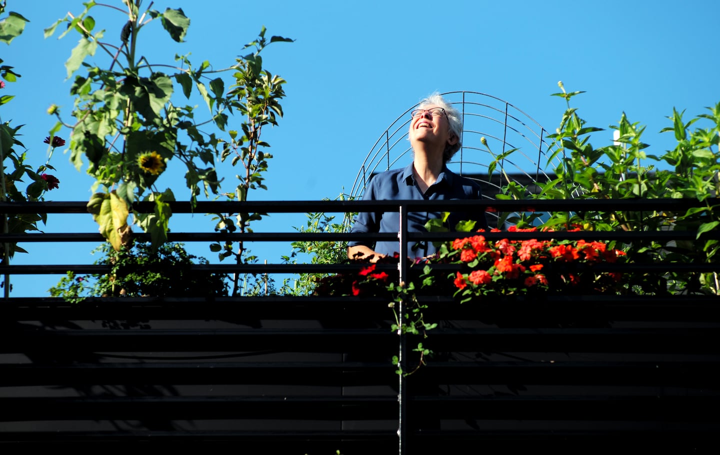 Barbara Bryant enjoys it when passersby, particularly children, ask her about her rooftop garden.