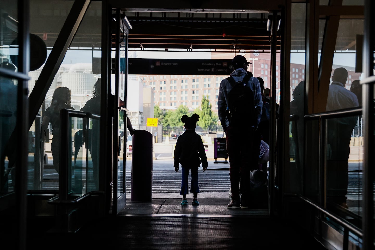 Migrant families leave the Boston Logan Airport to go to a day center in Quincy on July 9, 2024.