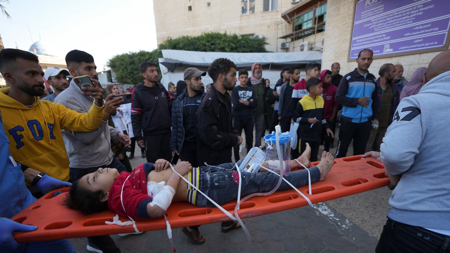 A wounded Palestinian child was carried on a stretcher at the Al-Aqsa Martyrs hospital in Deir al-Balah, following an Israeli bombardment in Nuseirat, central Gaza, Wednesday.