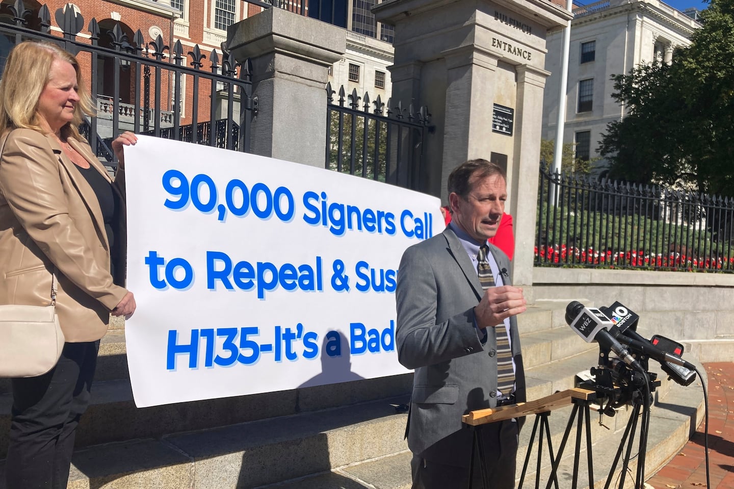 Gun shop owner and 2nd Amendment advocate Toby Leary announces outside the Massachusetts Statehouse in Boston, Tuesday, Oct. 8, 2024, that firearms activists have collected enough signatures to place a question on the Massachusetts 2026 ballot that would repeal the state's new sweeping gun law.